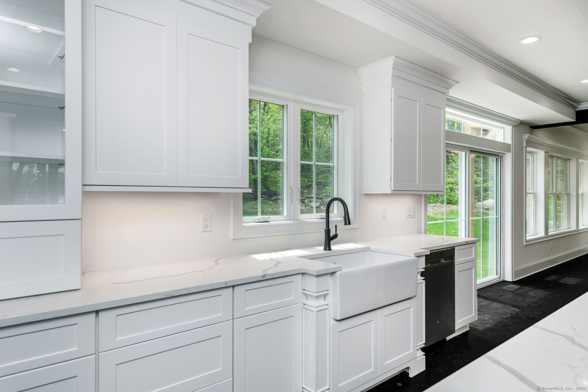 18 Sebastian Trail Newtown, CT 06470 - Photo 7 of 22 a kitchen with a sink and cabinets