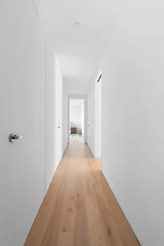 a bedroom with a bed and glass window
