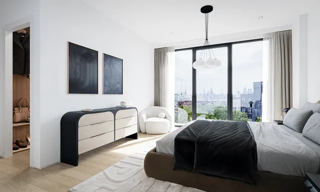 a bedroom with a bed and a large window