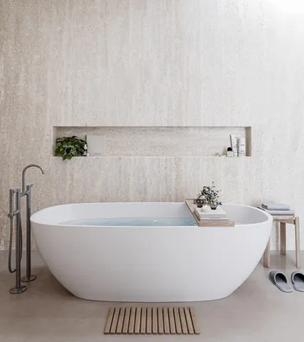 a white bath tub sitting in a bathroom
