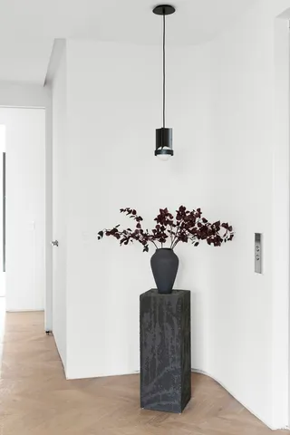 a balcony view with furniture and a potted plant