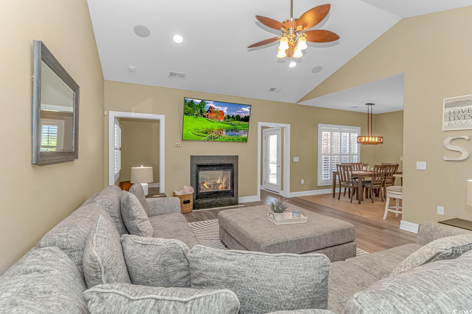3286 State Rd S-26-777 Loris, SC 29569 - Photo 7 of 40 Living room with vaulted ceiling, light hardwood /