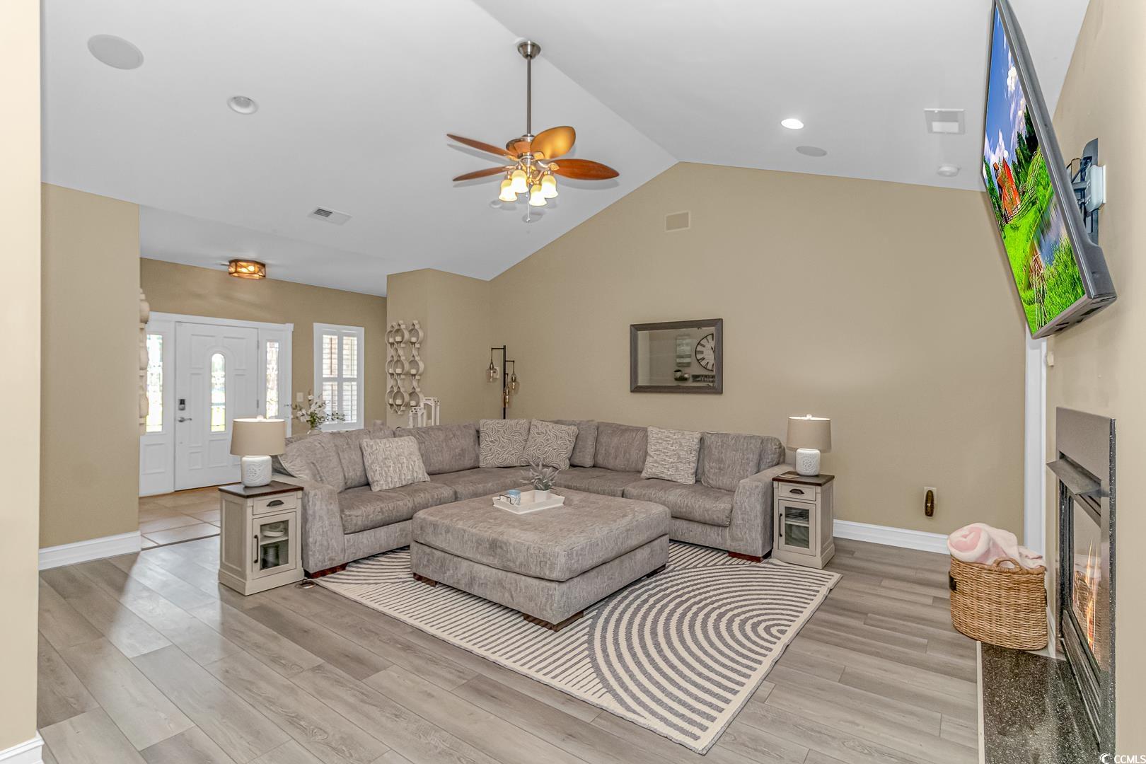 3286 State Rd S-26-777 Loris, SC 29569 - Photo 8 of 40 Living room featuring lofted ceiling, ceiling fan,