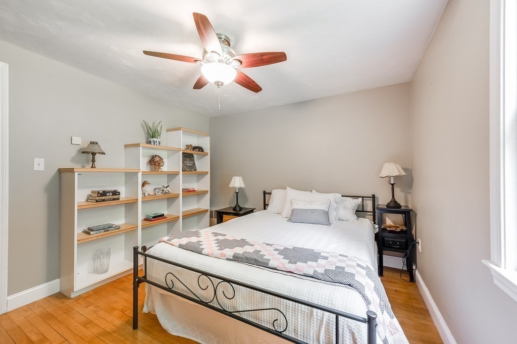 2470 West Street Wrentham, MA 02093 - Photo 18 of 42 a bedroom with a bed and cabinets