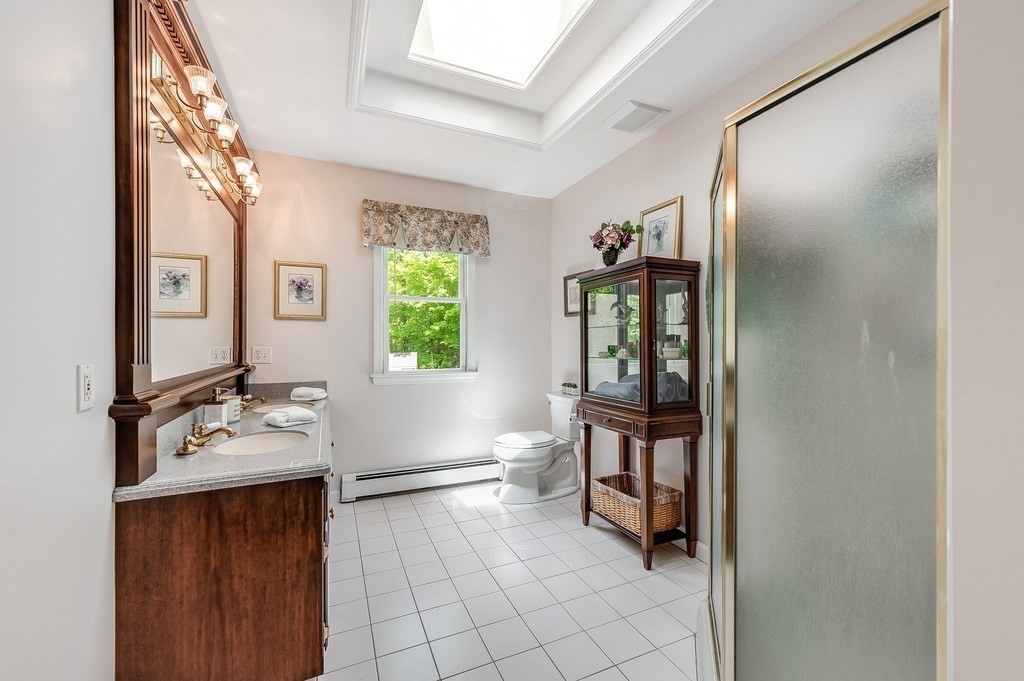 2470 West Street Wrentham, MA 02093 - Photo 24 of 42 a bathroom with a sink vanity and mirror