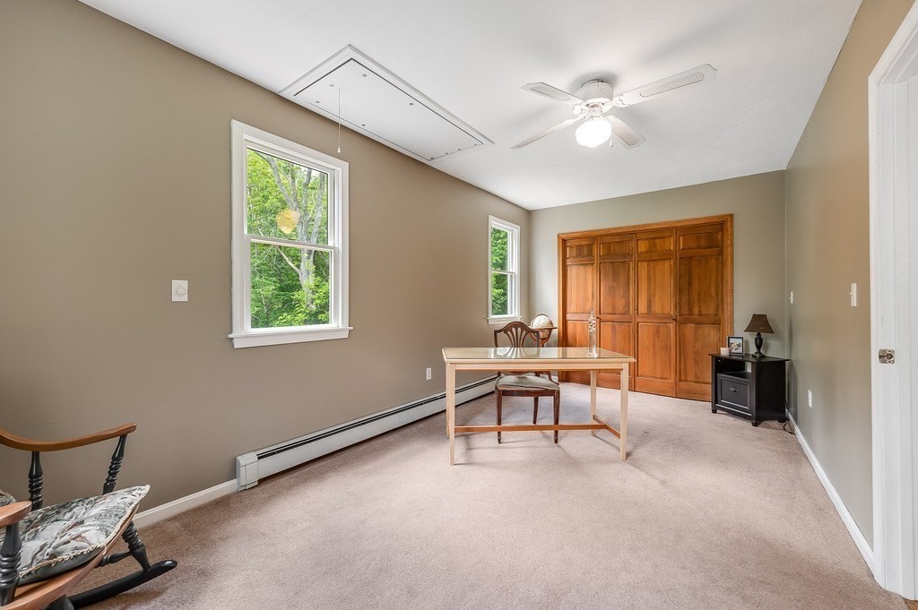 2470 West Street Wrentham, MA 02093 - Photo 27 of 42 a view of a workspace with furniture and a window