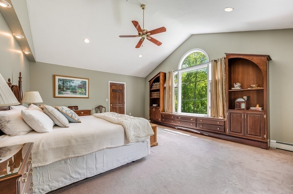 2470 West Street Wrentham, MA 02093 - Photo 29 of 42 a bedroom with a large bed and a large window