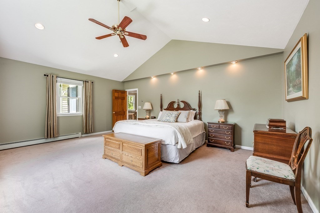 2470 West Street Wrentham, MA 02093 - Photo 31 of 42 a spacious bedroom with a bed and a chair