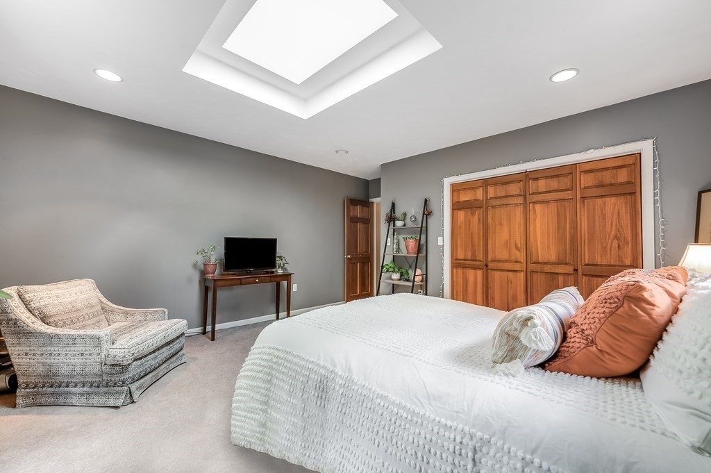 2470 West Street Wrentham, MA 02093 - Photo 33 of 42 a bedroom with a bed and a couch