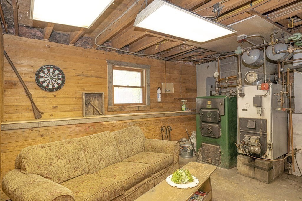 54 Gorham Street Rehoboth, MA 02769 - Photo 31 of 40 a view of a couch with wooden walls