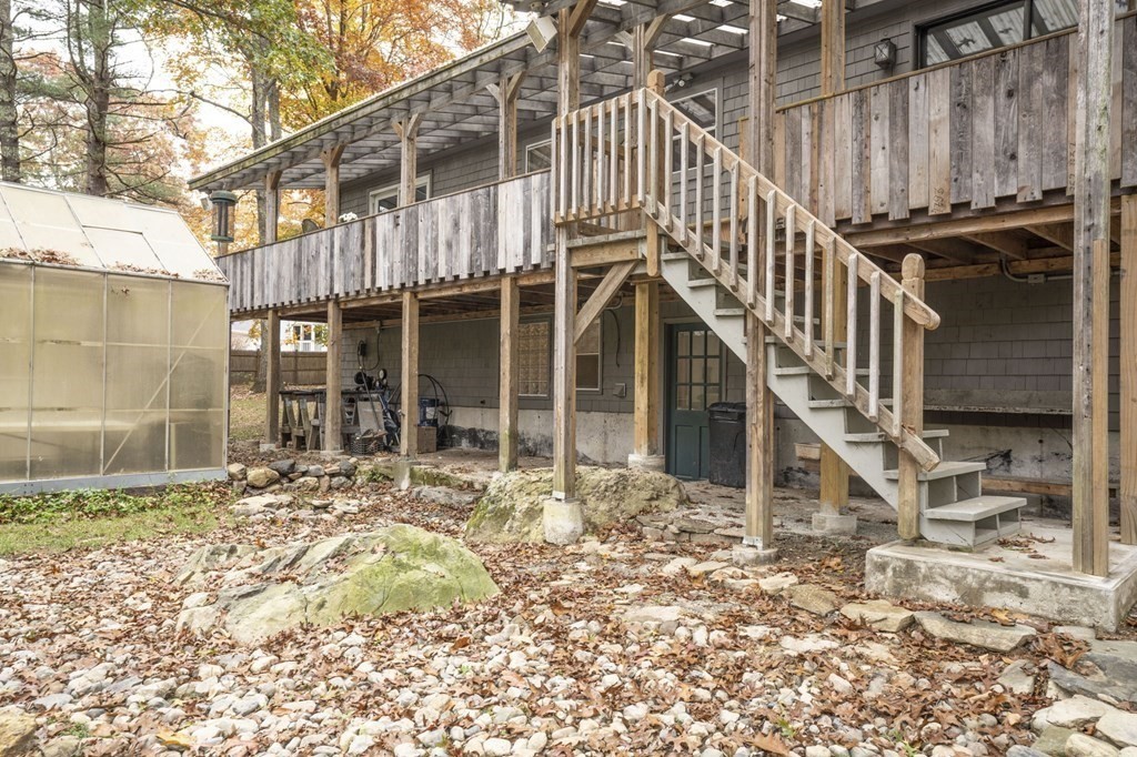 54 Gorham Street Rehoboth, MA 02769 - Photo 39 of 40 a view of a house with a large window and wooden fence