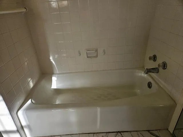 a close view of a bathtub in bathroom