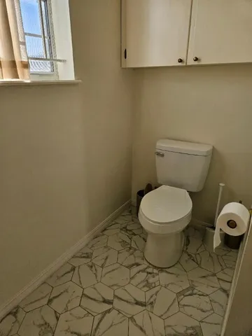 a bathroom with a toilet