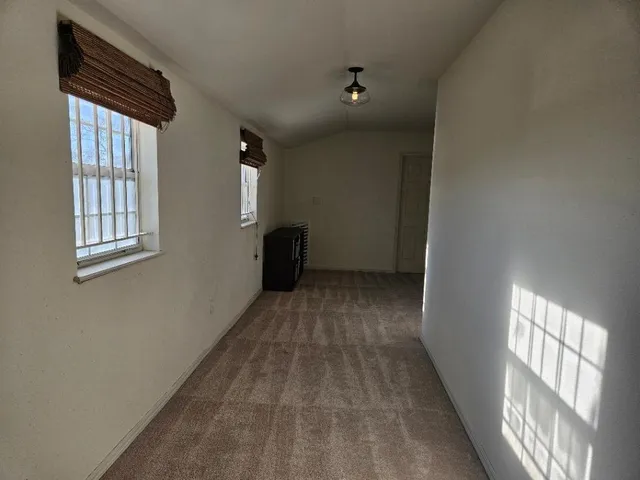 a view of empty room with windows