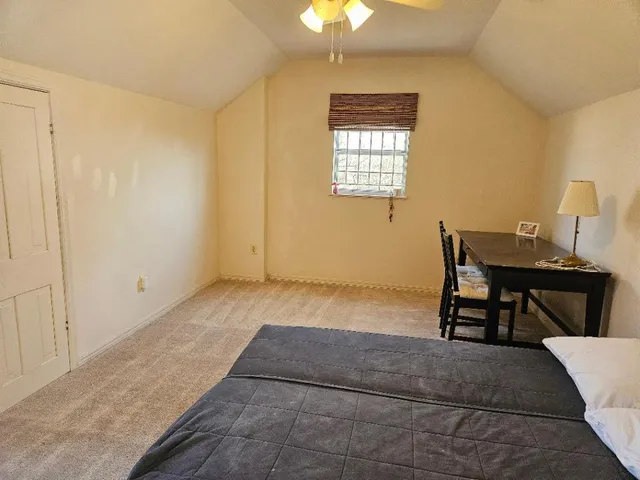 a workspace with furniture and window