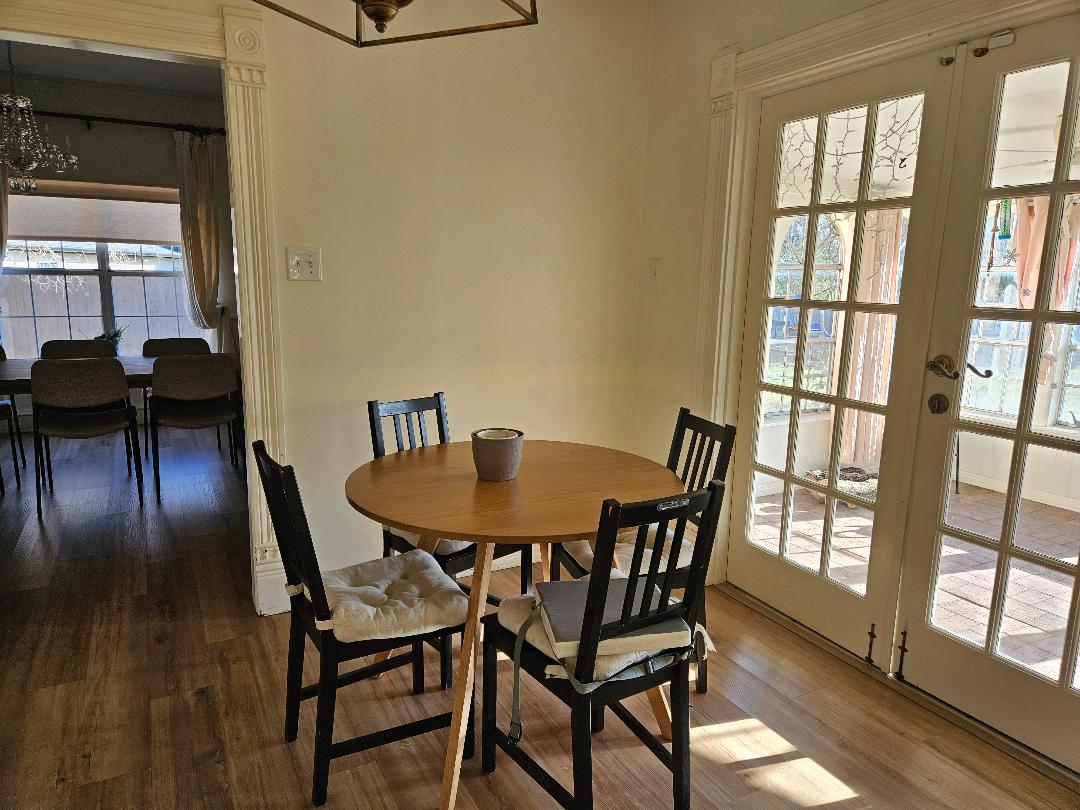 710 North Avenue C Elgin, TX 78621 - Photo 9 of 32 Breakfast area off the kitchen with French doors that open to the sunroom