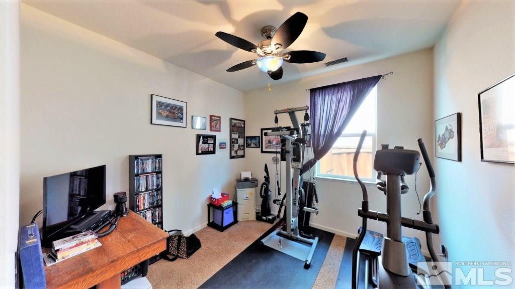 11200 Messina Way Reno, NV 89521 - Photo 13 of 19 a living room with furniture and a flat screen tv