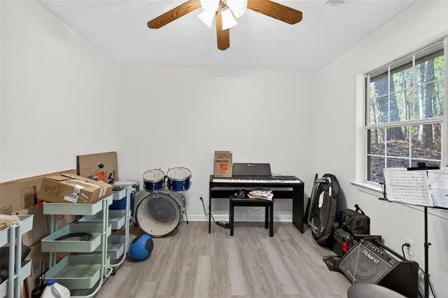 a view of workspace with wooden floor windows