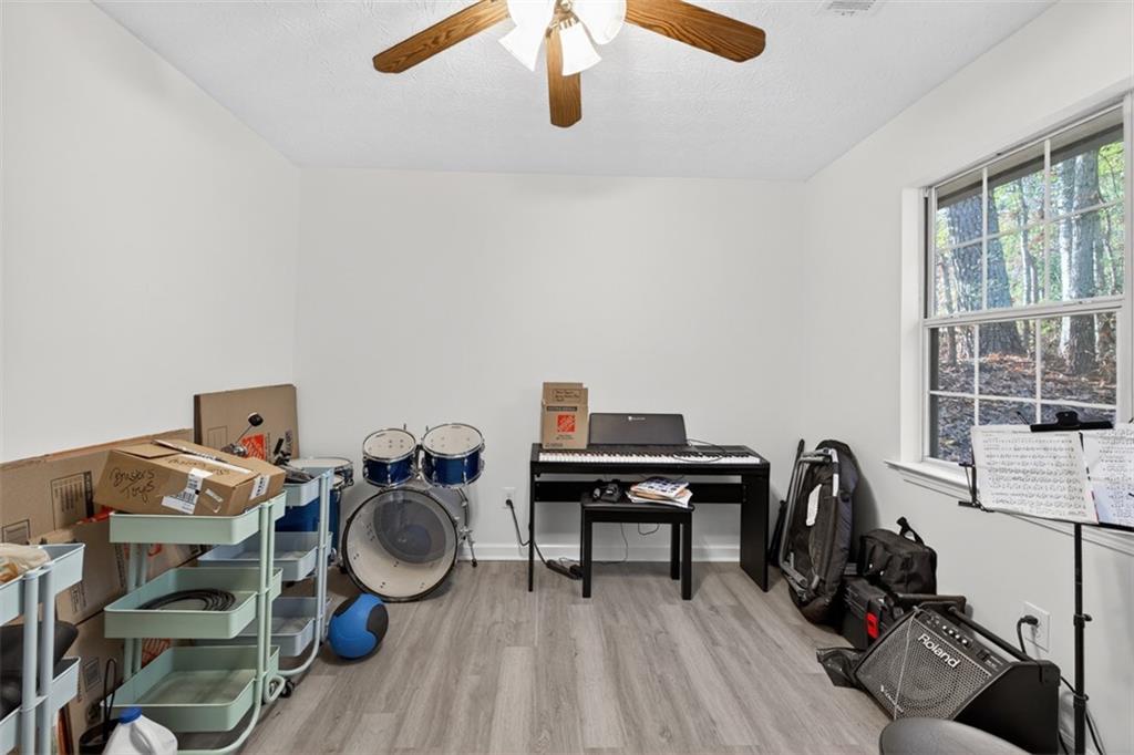 494 Spring Street Social Circle, GA 30025 - Photo 11 of 21 a view of workspace with wooden floor windows