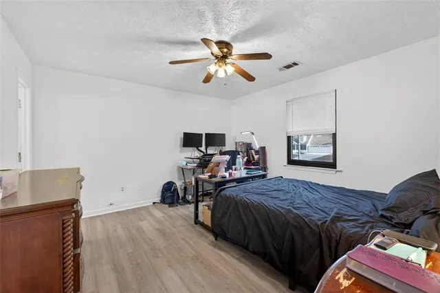 a bedroom with bed and a window