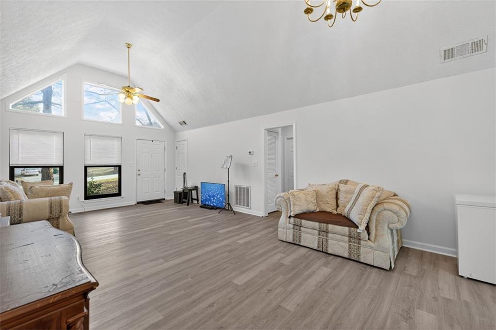 494 Spring Street Social Circle, GA 30025 - Photo 5 of 21 a living room with furniture and a wooden floor
