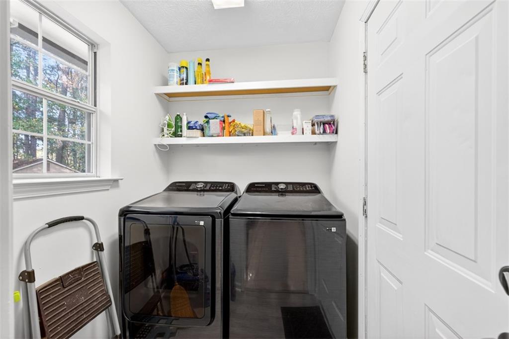 494 Spring Street Social Circle, GA 30025 - Photo 9 of 21 a utility room with dryer and washer