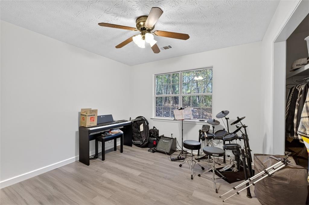 494 Spring Street Social Circle, GA 30025 - Photo 10 of 21 a view of a workspace with furniture and a window