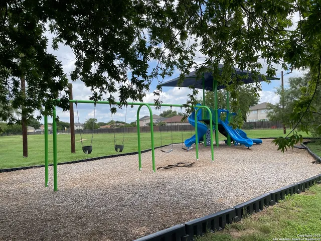 a view of park with swings