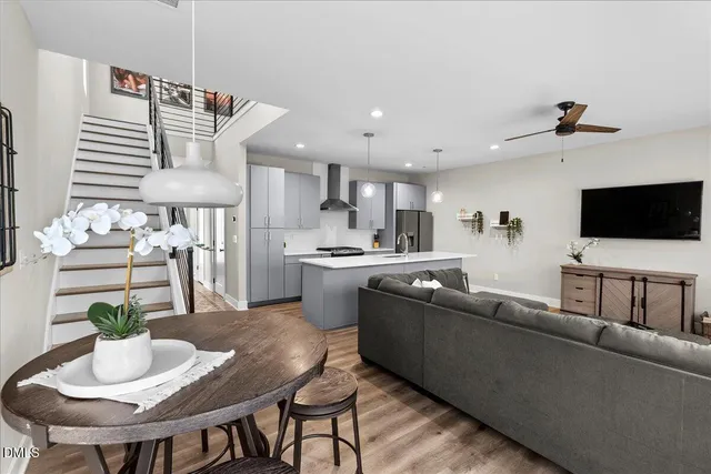 a view of entryway and hall with wooden floor