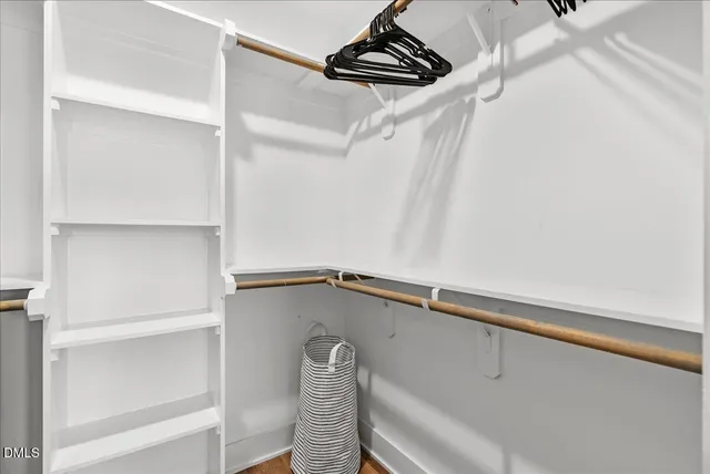 a bathroom with a sink a toilet and a large mirror