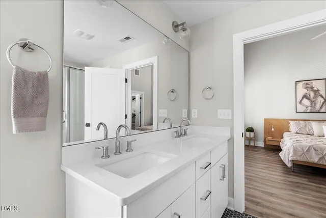 a view of a patio with table and chairs and wooden fence
