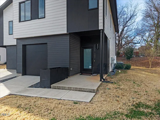 a view of a house with a snow in the yard