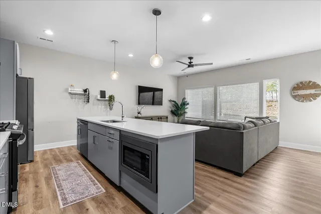 a stove top oven sitting inside of a kitchen