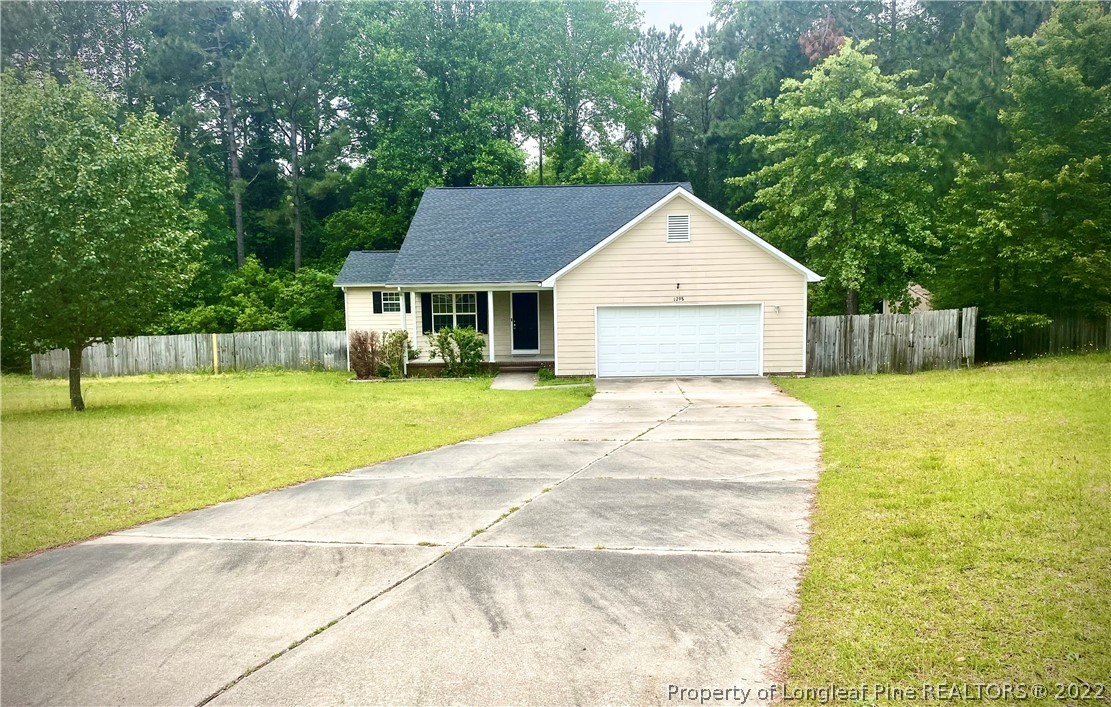1298 Roundabout Road Cameron, NC 28326 - Photo 2 of 29 a view of house with yard outdoor seating and barbeque oven