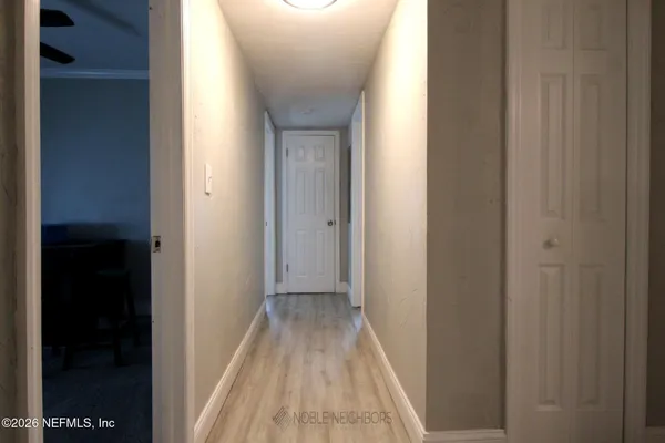 a view of a bathroom from the hallway