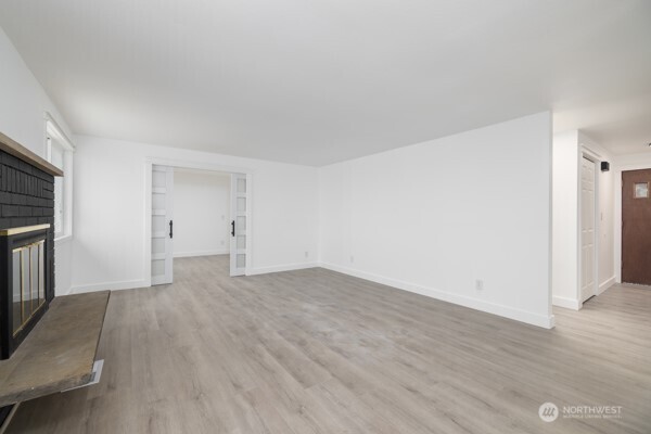 11586 Scott Road Bow, WA 98232 - Photo 13 of 28 a view of empty room with wooden floor and fan