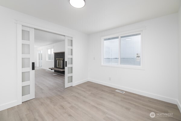 11586 Scott Road Bow, WA 98232 - Photo 16 of 28 a view of a kitchen with a sink and a refrigerator