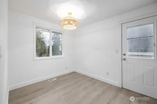 a view of empty room with a fireplace