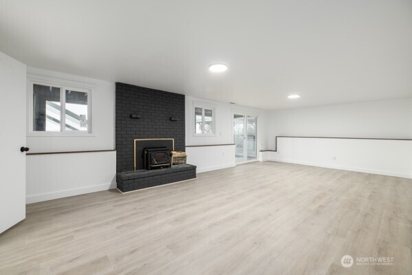 11586 Scott Road Bow, WA 98232 - Photo 21 of 28 a view of empty room with a fireplace