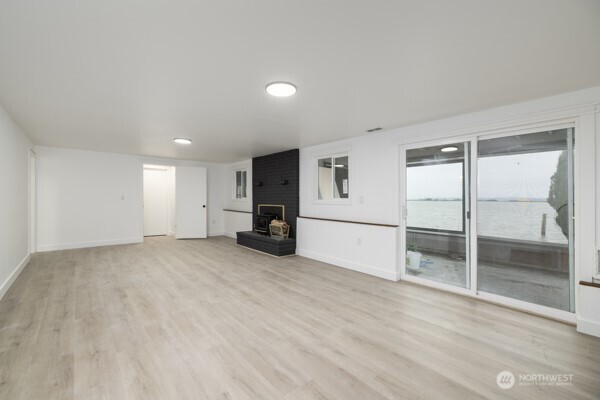 11586 Scott Road Bow, WA 98232 - Photo 22 of 28 a view of empty room with wooden floor