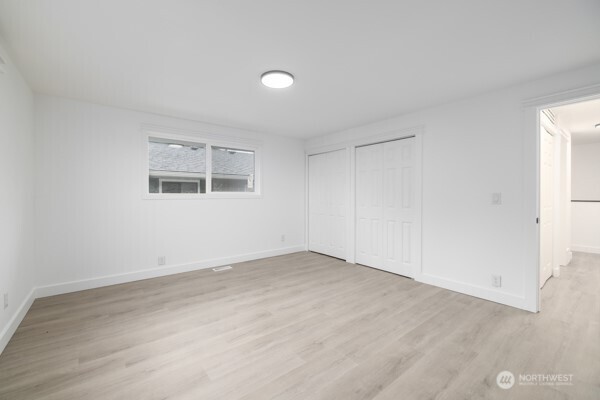 11586 Scott Road Bow, WA 98232 - Photo 23 of 28 an empty room with a empty space and windows