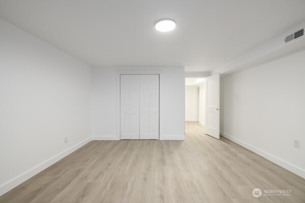 11586 Scott Road Bow, WA 98232 - Photo 26 of 28 a view of room with hardwood floor