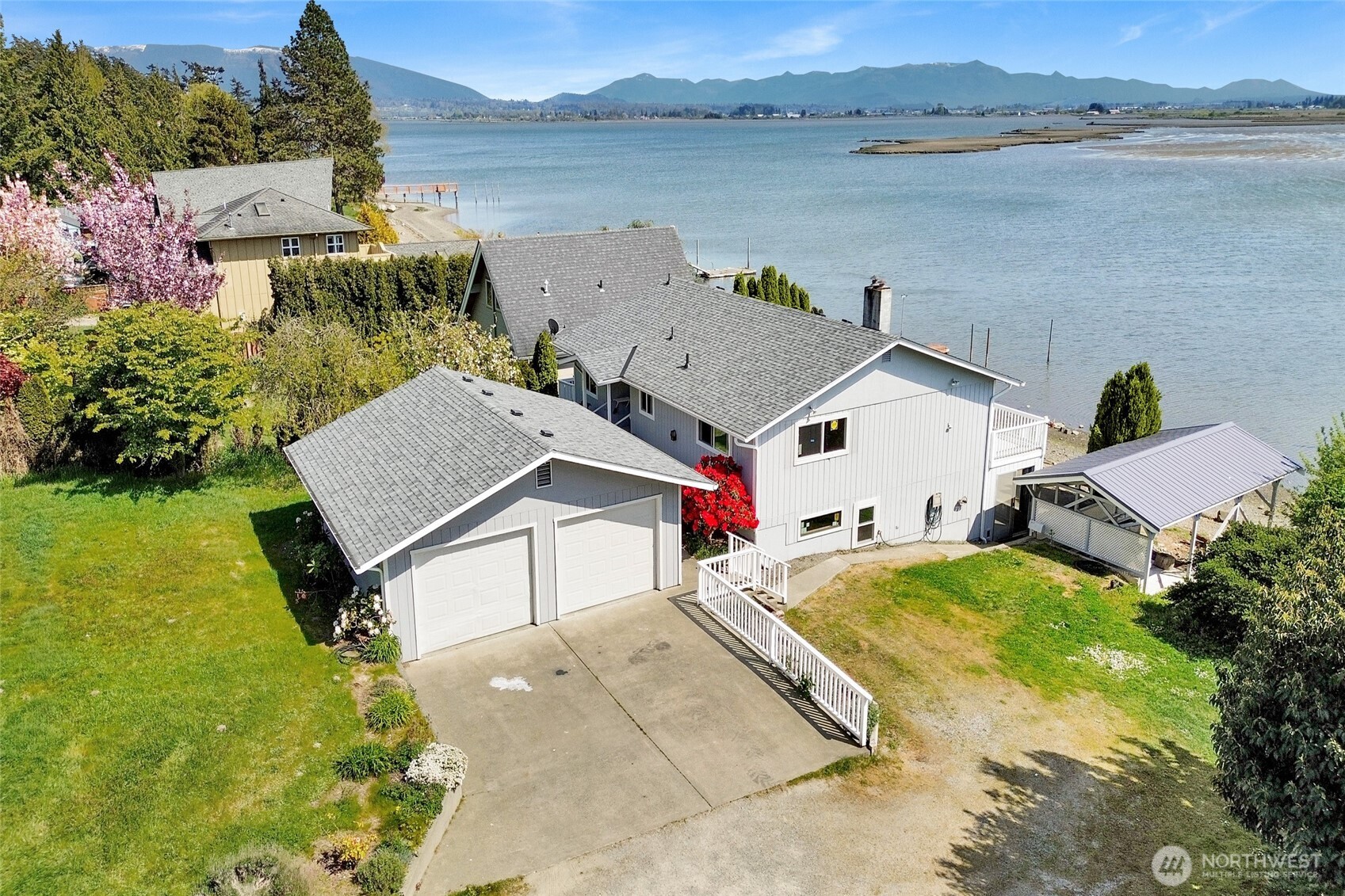 11586 Scott Road Bow, WA 98232 - Photo 4 of 28 a aerial view of a house with pool and a yard