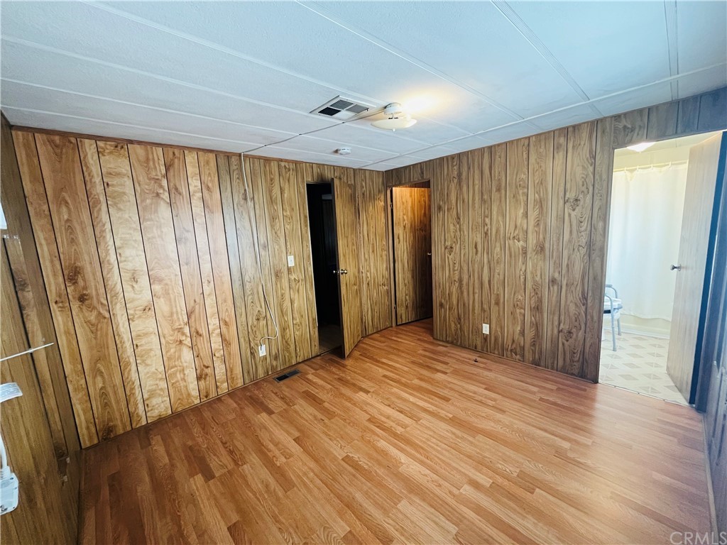 16601 Garfield Avenue, Unit 128 Paramount, CA 90723 - Photo 22 of 32 a view of a room with wooden walls