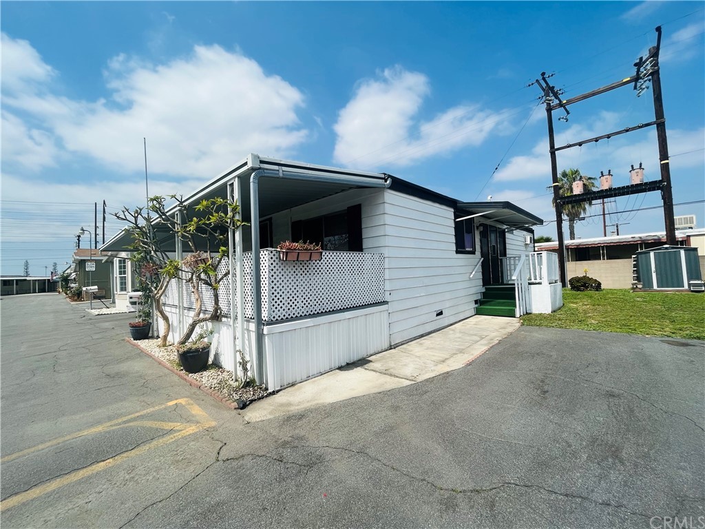 16601 Garfield Avenue, Unit 128 Paramount, CA 90723 - Photo 27 of 32 a view of a house with backyard