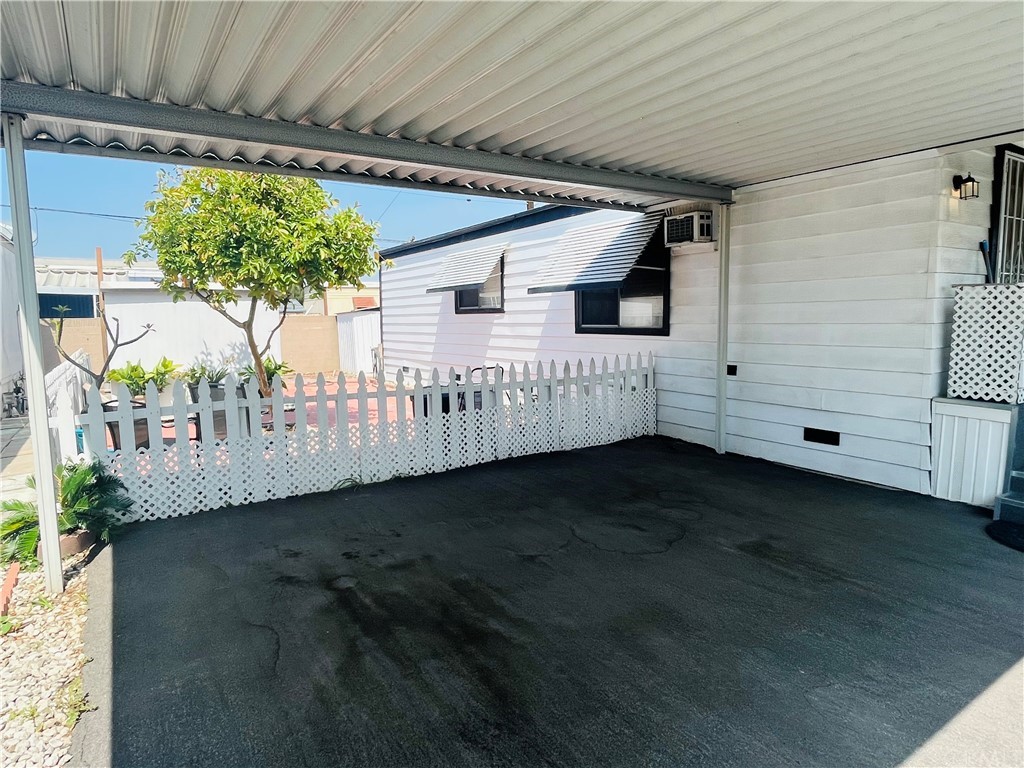16601 Garfield Avenue, Unit 128 Paramount, CA 90723 - Photo 5 of 32 a front view of a house with a yard
