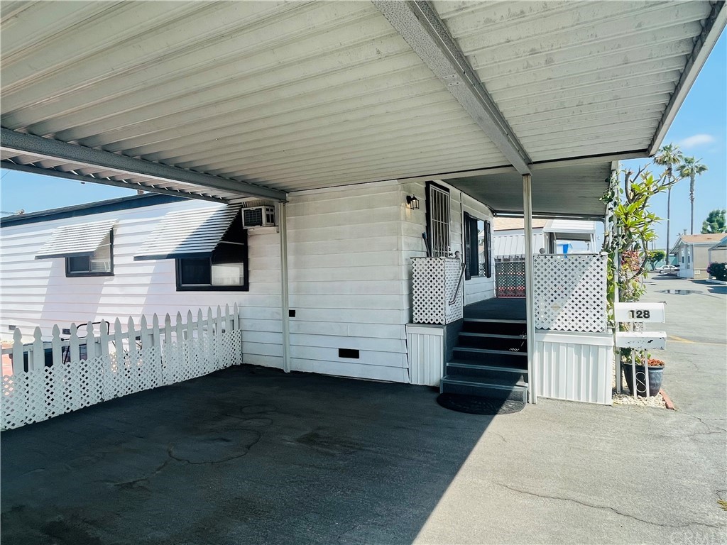 16601 Garfield Avenue, Unit 128 Paramount, CA 90723 - Photo 6 of 32 a view of a porch with hardwood