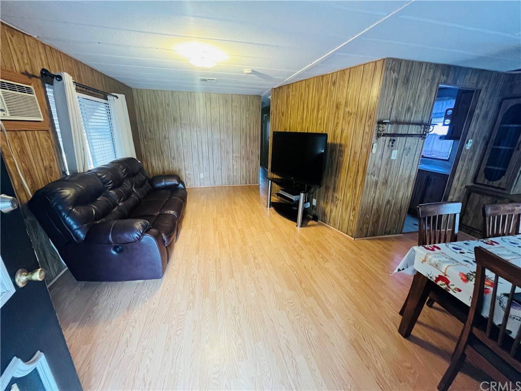 16601 Garfield Avenue, Unit 128 Paramount, CA 90723 - Photo 8 of 32 a bedroom with a bed window and a flat screen tv