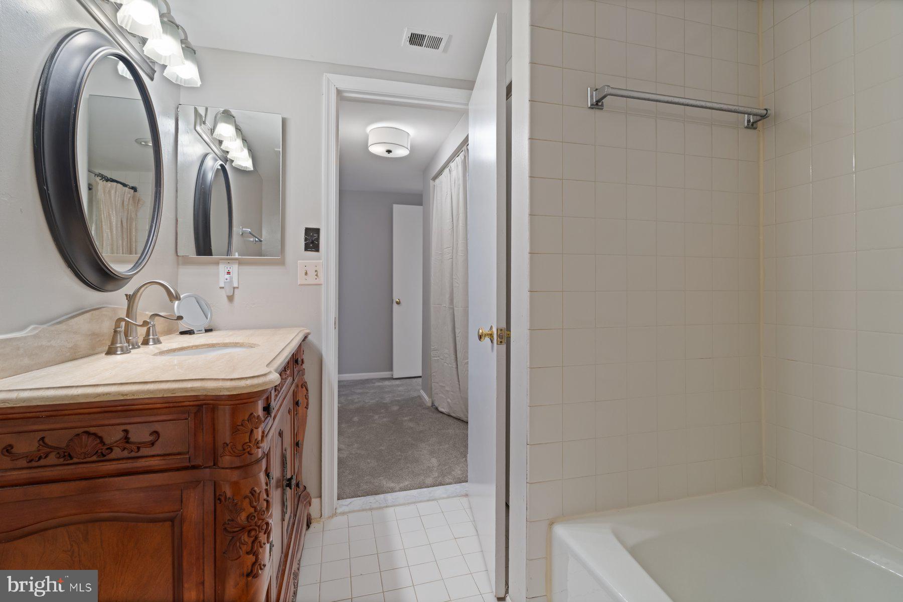 1040 Deer Ridge Drive, Unit 402 Baltimore, MD 21210 - Photo 13 of 34 Primary Bathroom, with large Linen Closet