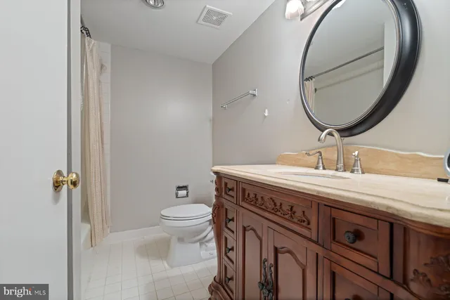 a bed room with a bed and a chair